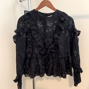 Sheer blouse with floral pattern.
